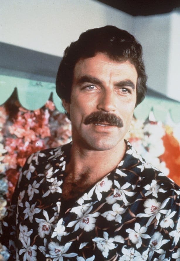 A photo of Tom Selleck wearing a floral print shirt