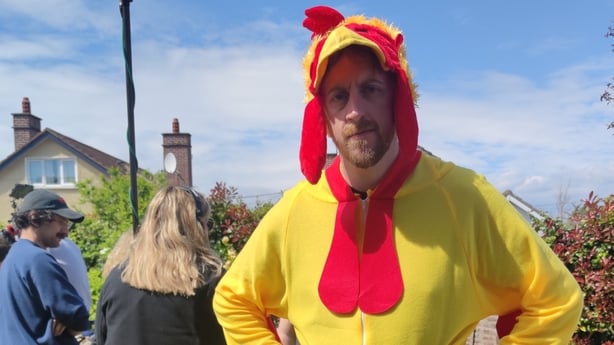 A man in fancy dress as a yellow chicken