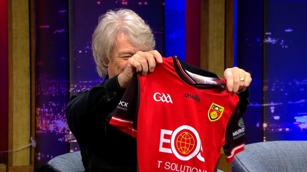 Jon Bon Jovi admires his Down jersey on The Late Late Show