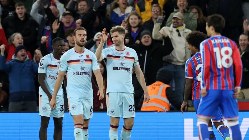 Nathan Collins of Brentford reacts after scoring that own goal