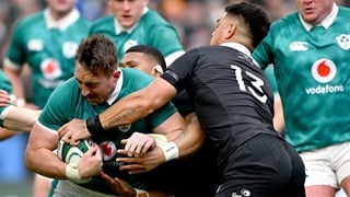 1 November 2025; Jack Conan of Ireland is tackled by Quinn Tupaea of New Zealand during the Gallagher Cup match between Ireland and New Zealand at Soldier Field in Chicago, USA. Photo by Ramsey Cardy/Sportsfile