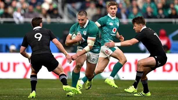 1 November 2025; Stuart McCloskey of Ireland in action against Cam Roigard, left, and Beauden Barrett of New Zealand during the Gallagher Cup match between Ireland and New Zealand at Soldier Field in Chicago, USA. Photo by Ramsey Cardy/Sportsfile