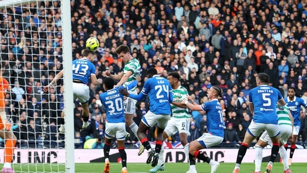 Johnny Kenny of Celtic scores against Rangers in 2025 Scottish League Cup semi-final