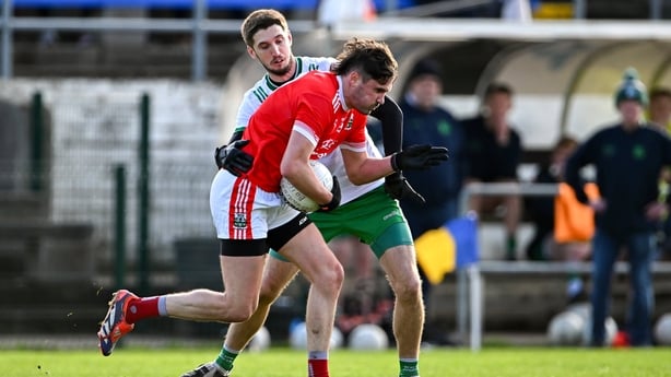 David Hyland of Athy (red) in action against Pat Burke of Baltinglass - 2025 Leinster club SFC