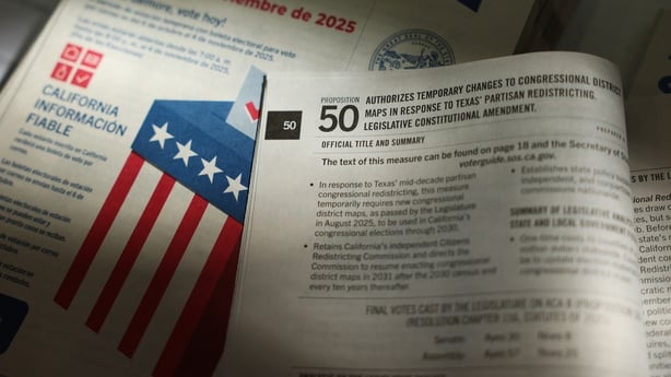 Voter information guides are displayed for a photograph at a vote center during early in-person voting for the California Proposition 50 special election in Los Angeles, California, on October 27, 2025. (