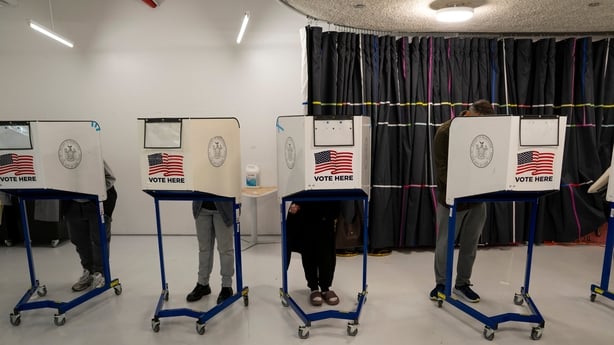 Voters cast their ballot at a polling station on the final day of early voting in the Queens borough of New York, US, on Sunday, Nov. 2, 2025. New York voters are turning out early in high numbers for a mayoral race that's captured the country's attention. Photographer: Christian Monterrosa/Bloomber