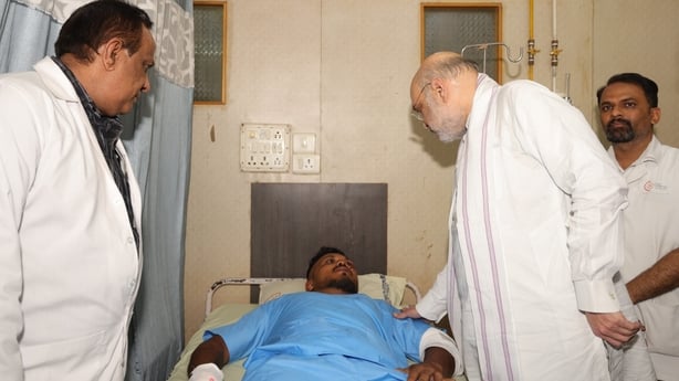 Handout photo issued by the Ministry of Home Affairs India of Home Affairs Minister Amit Shah meeting British plane crash survivor Vishwash Kumar Ramesh, 40, at a hospital in Ahmedabad. Air India confirmed Mr Ramesh was the sole survivor of the 242 people on board the London-bound Boeing 787 Dreamli