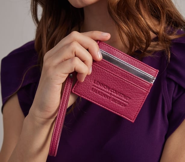 Woman modeling a card holder