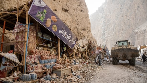 Damaged shops are pictured along a highway, following an earthquake 