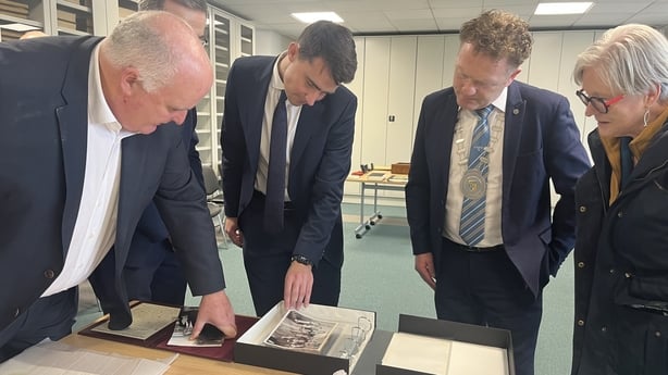 Minister Jack Chambers looks at items in the Albert Reynolds gift collection in Longford Library