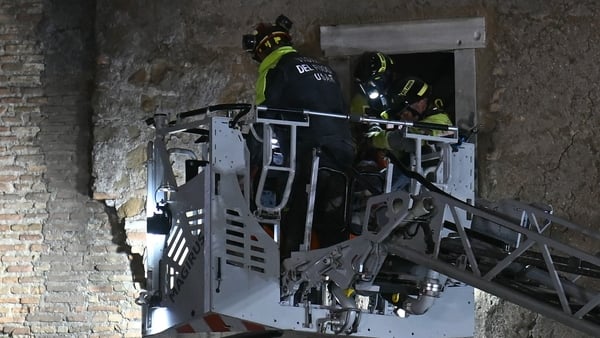 Rescuers evacuate the worker who was trapped in the medieval tower 'Torre dei Conti'