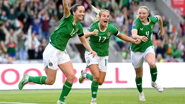 Republic of Ireland's Anna Patten, left, celebrates after scoring her side's third goal with team-mates Lily Agg and Louise Quinn, right, during the 2025 UEFA Women's European Championship qualifying group A match between Republic of Ireland and France at