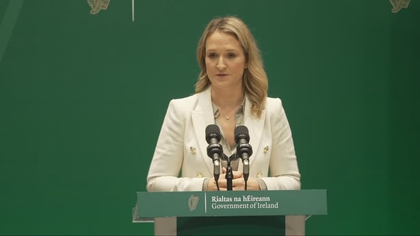 An image of Helen McEntee speaking at a press conference