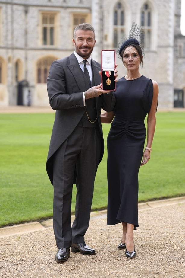David Beckham, with his wife Victoria, after he was made a Knight Bachelor at an investiture ceremony at Windsor Castle, Berkshire Photo: Andrew Matthews/PA Wire
