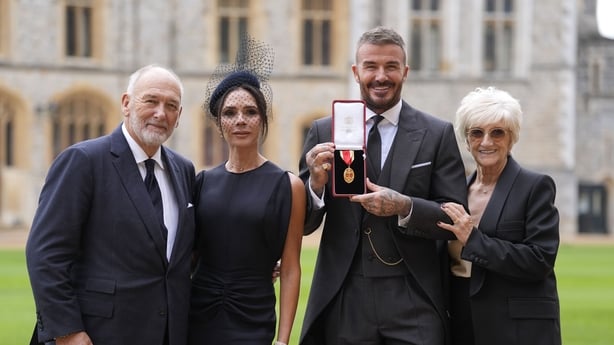 David Beckham, with his wife Victoria, and his parents Ted and Sandra after he was made a Knight Bachelor at an investiture ceremony at Windsor Castle, Berkshire Photo: Andrew Matthews/PA Wire