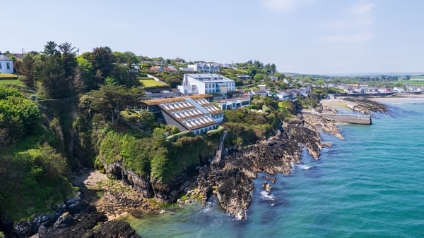 An aerial photo of The Cliff House Hotel, located on a cliff overlooking Ardmore Bay