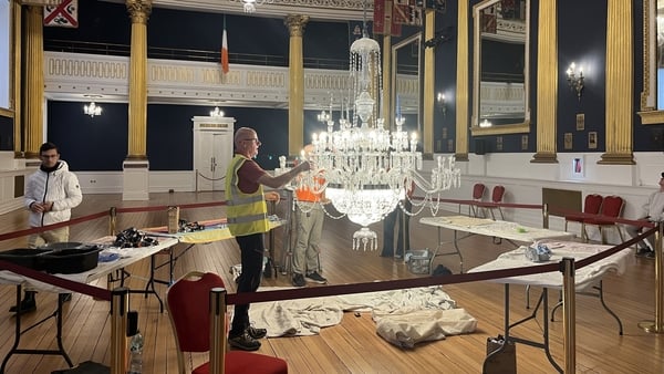 A chandelier is cleaned at Dublin Castle ahead of the inauguration