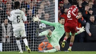 LIVERPOOL, ENGLAND - NOVEMBER 4: Thibaut Courtois, goalkeeper of Real Madrid CF saves from Dominik Szoboszlai of Liverpool during the UEFA Champions League 2025/26 League Phase MD4 match between Liverpool FC and Real Madrid C.F. at Anfield on November 4,