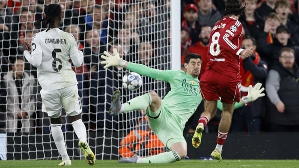 LIVERPOOL, ENGLAND - NOVEMBER 4: Thibaut Courtois, goalkeeper of Real Madrid CF saves from Dominik Szoboszlai of Liverpool during the UEFA Champions League 2025/26 League Phase MD4 match between Liverpool FC and Real Madrid C.F. at Anfield on November 4,