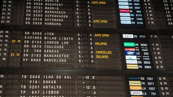 The departure board with cancelled and delayed flights in Brussels Airport