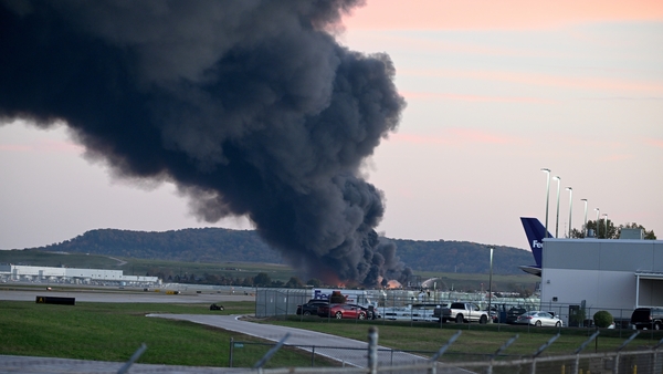 Fire and smoke mark where a UPS cargo plane crashed near Louisville Muhammad Ali International Airport in Kentucky