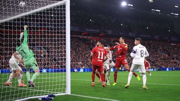 LIVERPOOL, ENGLAND - NOVEMBER 4: Real Madrid goalkeeper Thibaut Courtois makes a save from Virgil van Dijk of Liverpool during the UEFA Champions League 2025/26 League Phase MD4 match between Liverpool FC and Real Madrid C.F. at Anfield on November 4, 2025 in Liverpool, England. (Photo by Simon Stac