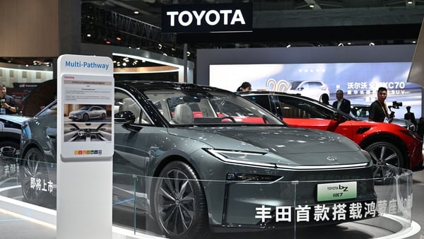 A grew Toyota bZ7 vehicle displayed at a car show