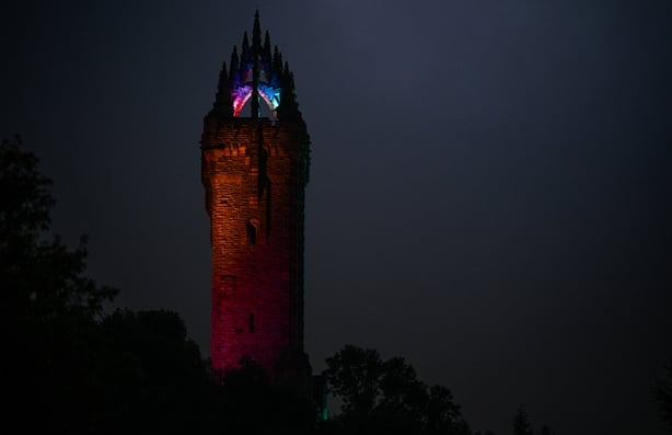 STIRLING, SCOTLAND - SEPTEMBER 21: The National Wallace Monument is illuminated on bright rainbow colours specially for Stirling Pride on September 21, 2024 in Stirling, Scotland. This is the first Pride Event to take place in Stirling and the Forth Valley. It comes after nearly 300 Forth Valley res