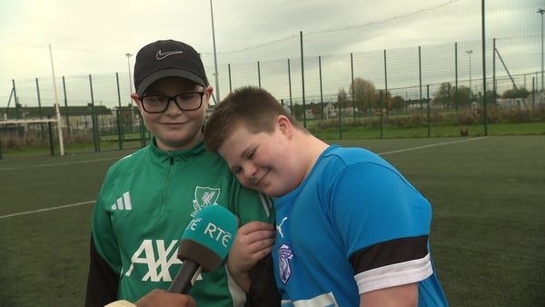 Two young boys hug as they are interviewed on RTÉ TV.