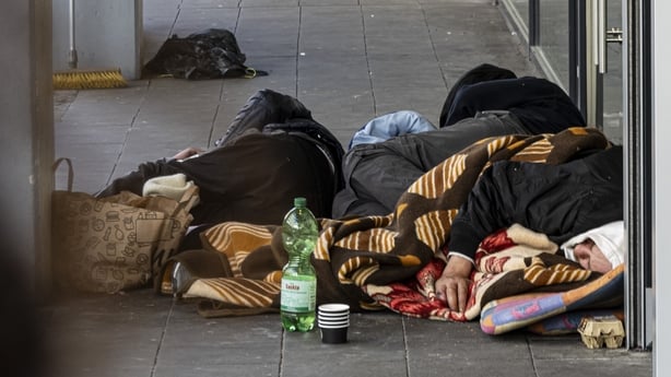 Homeless people sleep on the street in Dusseldorf, Germany