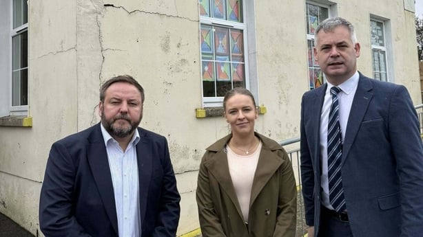 Pearse Doherty Pádarig Mc Lochlainn stand outside Drumfad National School.