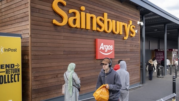 People outside supermarket chain Sainsbury's alongside Argos