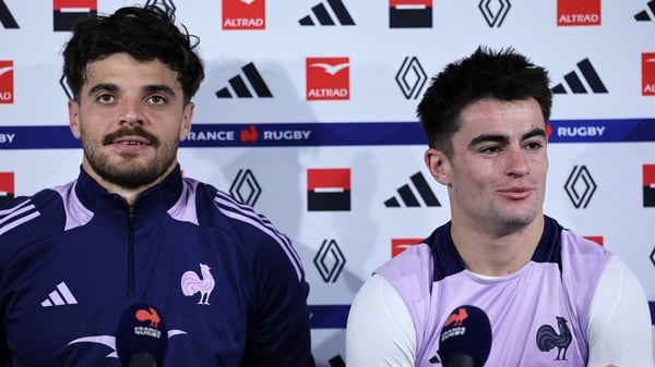 France's fly-half Romain Ntamack (L) and France's scrum-half Nolann Le Garrec