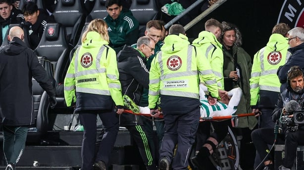 Celtic Interim Manager Martin O'Neill checks in on the injured Callum Osmand as he is taken off on a stretcher