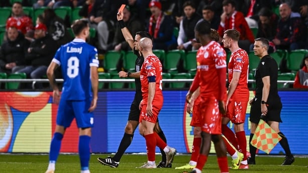 6 November 2025; Referee Oliver Reitala shows a red card to James Norris of Shelbourne, not pictured, after a VAR review during the UEFA Conference League 2025/26 league phase match between Shelbourne and Drita at Tallaght Stadium in Dublin. Photo by Ben McShane/Sportsfile