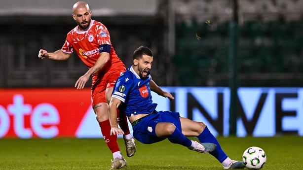 Mark Coyle challenges Albert Daviqaj of Drita