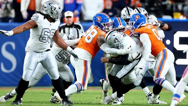 DENVER, COLORADO - NOVEMBER 06: John Franklin-Myers #98 of the Denver Broncos sacks Geno Smith #7 of the Las Vegas Raiders during the second quarter in the game at Empower Field At Mile High on November 06, 2025 in Denver, Colorado. (Photo by Jamie Schwab