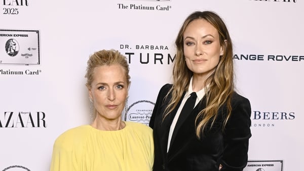 Gillian Anderson, winner of Entrepreneur of The Year Award, poses with Olivia Wilde