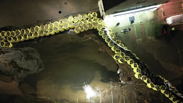 An aerial view from Volendam as the village places sandbags along a body of water