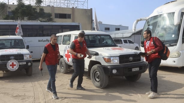 Teams from the International Committee of the Red Cross bring the bodies of 15 Palestinians to Nasser Hospital