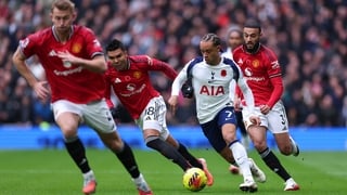 Xavi Simons of Tottenham Hotspur under pressure from Noussair Mazraoui and Casemiro of Manchester United during the Premier League match between Tottenham Hotspur and Manchester United at Tottenham Hotspur Stadium on November 8, 2025 in London, England. (