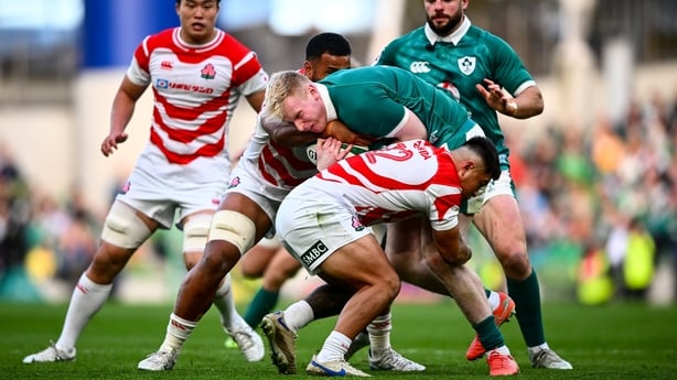 8 November 2025; Jamie Osborne of Ireland is tackled by Faulua Makisi, left, and Charlie Lawrence of Japan during the Quilter Nations Series 2025 match between Ireland and Japan at the Aviva Stadium in Dublin. Photo by Shauna Clinton/Sportsfile