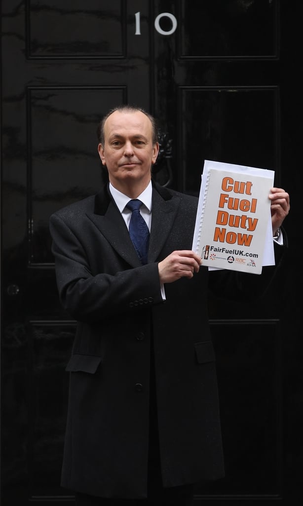 Spokesman for FairFuelUK Quentin Willson poses for the press before handing in a petition at 10 Downing Street on 7 March, 2012 in London
