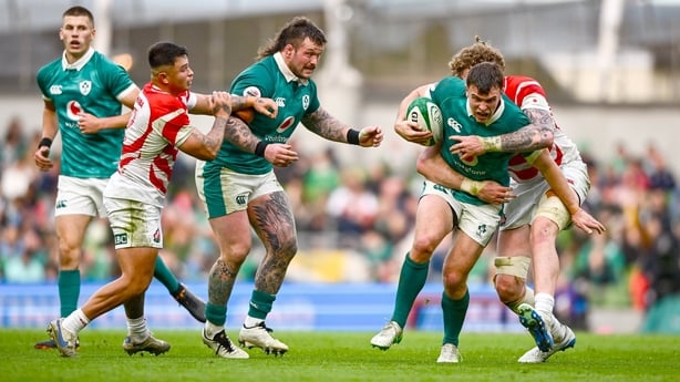 8 November 2025; Tom Farrell of Ireland is tackled by Warner Dearns of Japan during the Quilter Nations Series 2025 match between Ireland and Japan at the Aviva Stadium in Dublin. Photo by Shauna Clinton/Sportsfile