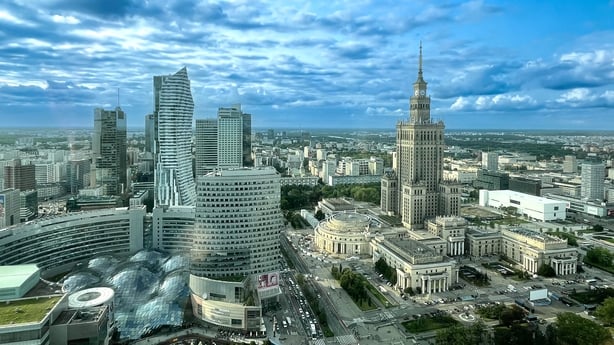 Aerial image of the "skyline" of Warsaw with modern skyscrapers under dramatic sky