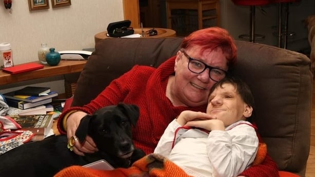 Johanne Powell and daughter Siobhán at home with their pet dog