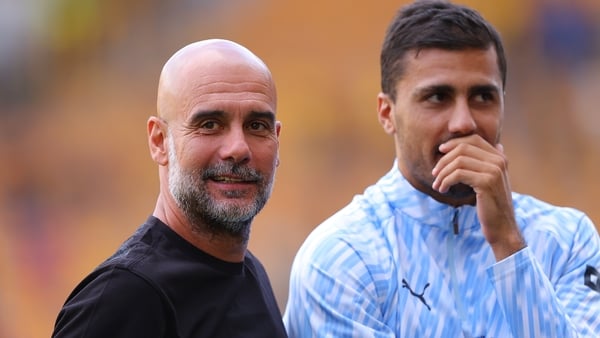 WOLVERHAMPTON, ENGLAND - AUGUST 16: Josep 'Pep' Guardiola, head coach of Manchester City, jokes with Rodri of Manchester City during the Premier League match between Wolverhampton Wanderers and Manchester City at Molineux on August 16, 2025 in Wolverhampt
