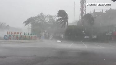 Strong gust of wind bends palm trees as super typhoon hits central Philippines