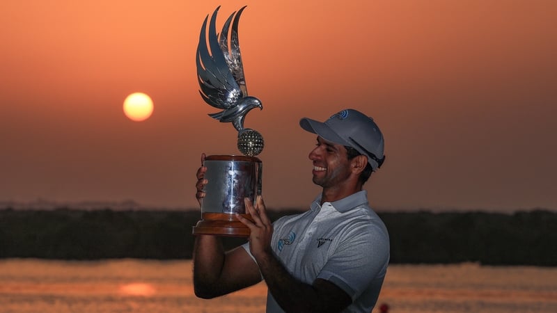 Aaron Rai poses with the Falcon Trophy after his win