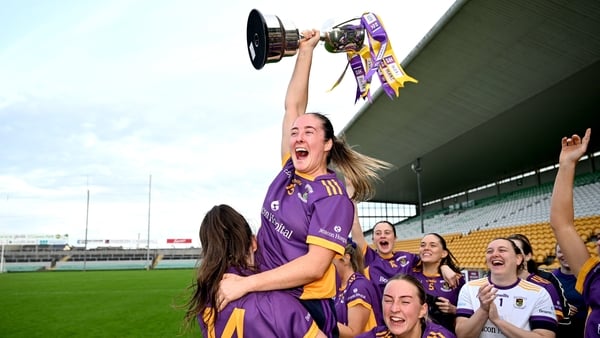 9 November 2025; Kilmacud Crokes captain Éabha Rutledge and her teammates, Michelle Davoren, 14 and Ailbhe Davoren, 11, celebrate with the Bill Daly cup after the AIB Leinster LGFA Senior Club Championship Final between Tinahely of Wicklow and Kilmacud Cr